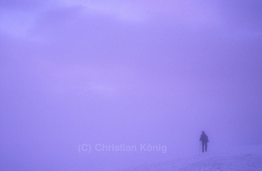 Descending from Glittertinden on a summer morning after having enjoyed sunrise on its top. Only ten minutes after sunrise the whole mountain was already covered by fog. As we encountered much fog for the third time visiting this summit we decided to call this mountain from now tåketind.