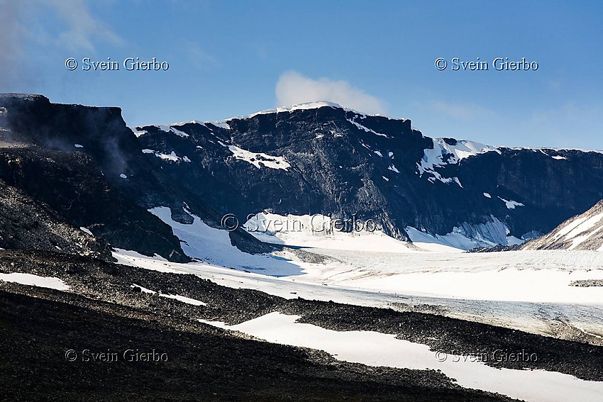 In Trollsteinkvelven valley loooking towards Glittertinden, Norways second highest mountain (right to left) and Austre Glittertindoksle, Grotbrean glacier below. Jotunheimen National Park. Norway. Jotunheimen National Park. Norway.