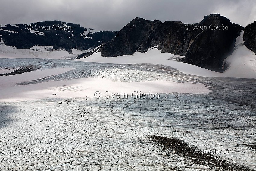 On Grotbrean glacier loooking towards Trollsteineggje (right) and Glittertind, Norways second highest mountain. Jotunheimen National Park. Norway.