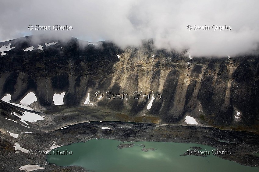 Trollsteintjønne lake and Rundhøe (left). Jotunheimen National Park. Norway