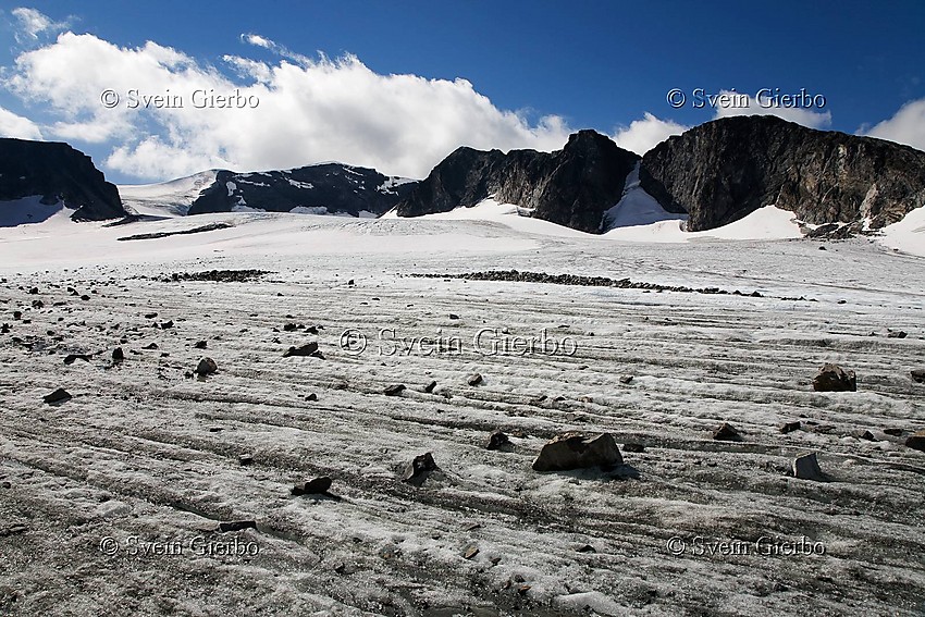 On Grotbrean glacier loooking towards Trollsteineggje (right) and Glittertinden, Norways second highest mountain. Jotunheimen National Park. Norway.