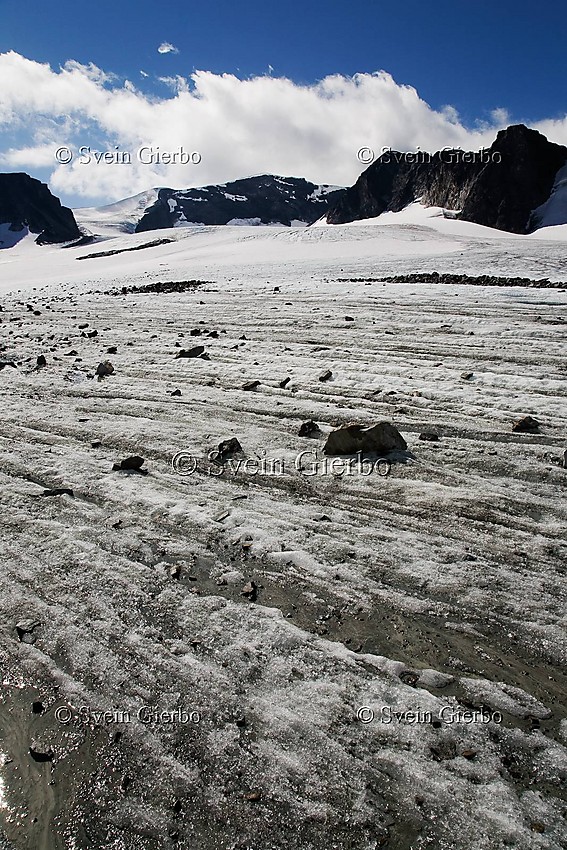 On Grotbrean glacier loooking towards Trollsteineggje (right) and Glittertinden, Norways second highest mountain. Jotunheimen National Park. Norway.