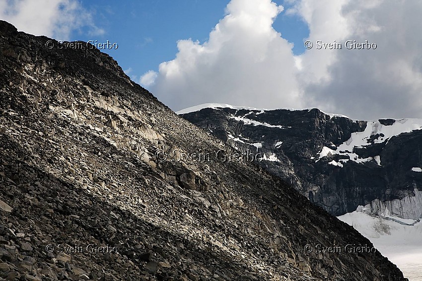 The west slope of Trollsteineggje with Glittertind, Norways second highest mountain behind. Jotunheimen National Park. Norway.