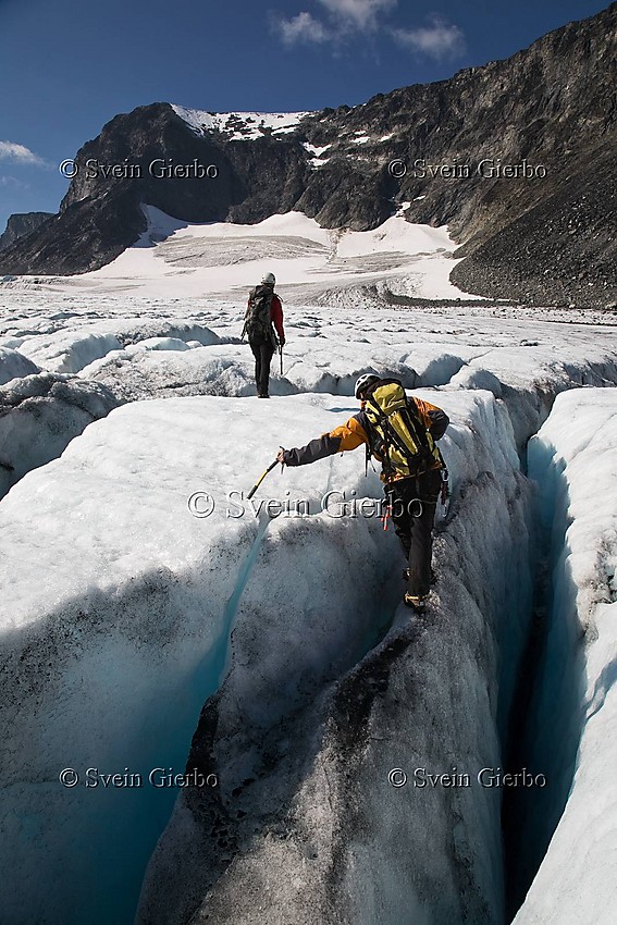 Hikers on Storjuvbrean glacier. Jotunheimen National Park. Norway.